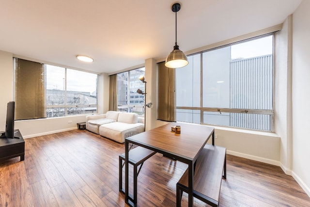 1212 Guadalupe St Unit 301, Austin, TX 78701 - dining space with wood finished floors and baseboards