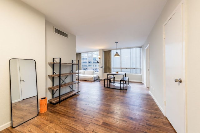 1212 Guadalupe St Unit 301, Austin, TX 78701 - living area with wood finished floors and baseboards