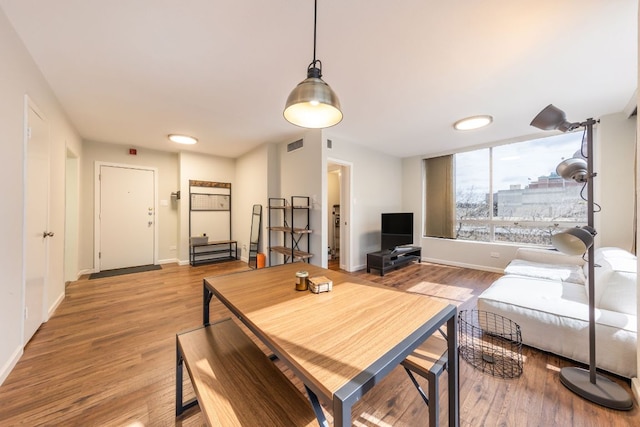 1212 Guadalupe St Unit 301, Austin, TX 78701 - dining area with light wood-style floors