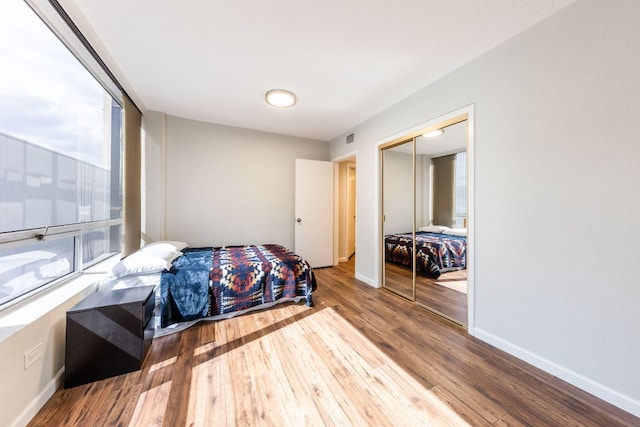 1212 Guadalupe St Unit 301, Austin, TX 78701 - bedroom with wood finished floors and a closet
