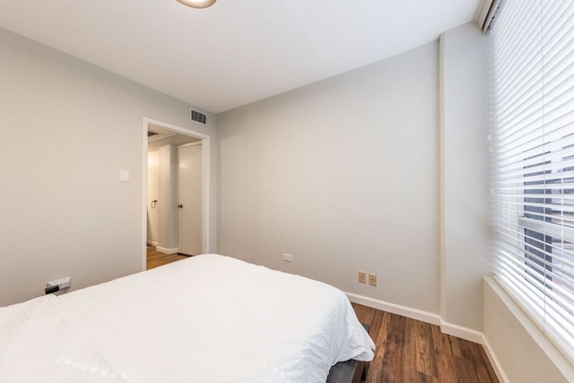 1212 Guadalupe St Unit 301, Austin, TX 78701 - bedroom with dark wood-style floors and multiple windows