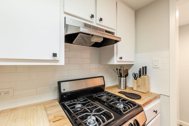 1212 Guadalupe St Unit 301, Austin, TX 78701 - kitchen featuring gas range, under cabinet range hood, and white cabinets