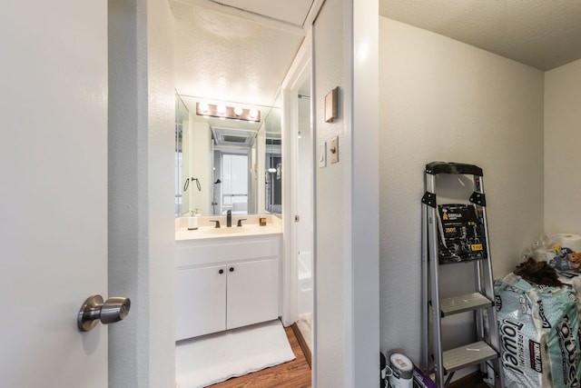 1212 Guadalupe St Unit 301, Austin, TX 78701 - bathroom with vanity and wood finished floors