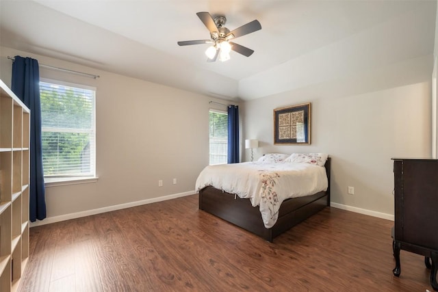 2004 Yaupon Trl, Cedar Park, TX 78613 - bedroom featuring multiple windows, wood finished floors, a ceiling fan, and vaulted ceiling