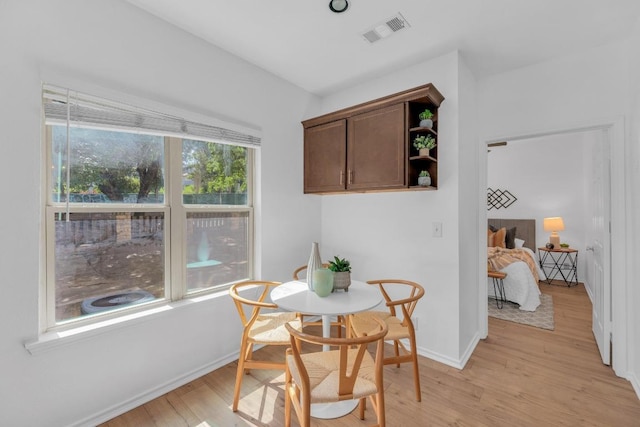 2414 Longview St Unit 101, Austin, TX 78705 - dining area featuring light wood-type flooring and baseboards