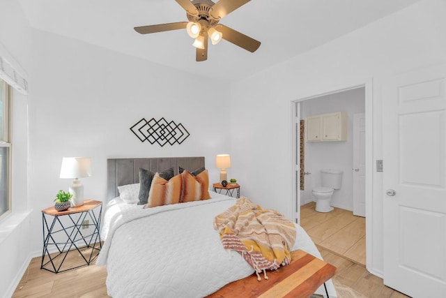 2414 Longview St Unit 101, Austin, TX 78705 - bedroom featuring light wood finished floors, connected bathroom, and a ceiling fan