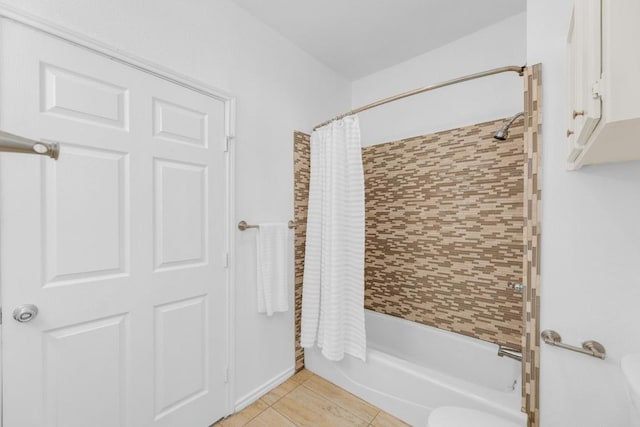 2414 Longview St Unit 101, Austin, TX 78705 - bathroom with shower / bath combo with shower curtain and tile patterned floors