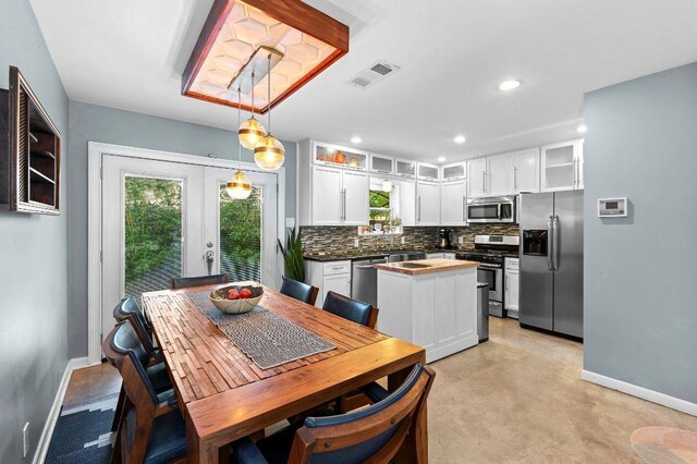 1214 Arthur Stiles Rd, Austin, TX 78721 - dining room featuring french doors, finished concrete floors, and recessed lighting
