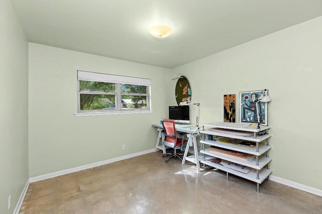 1214 Arthur Stiles Rd, Austin, TX 78721 - home office featuring finished concrete flooring and baseboards