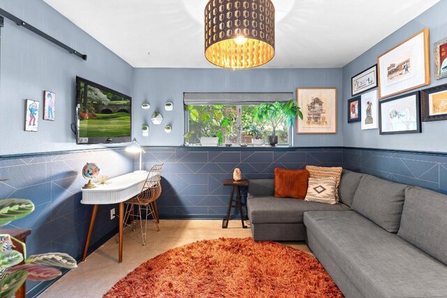 1214 Arthur Stiles Rd, Austin, TX 78721 - living area with tile walls and a wainscoted wall
