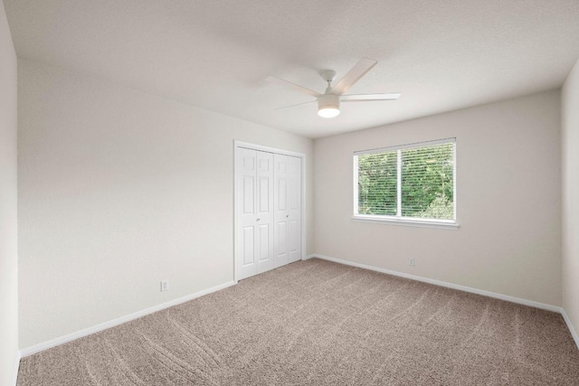7517 Robert Kleburg Ln, Austin, TX 78749 - unfurnished bedroom with carpet flooring, a closet, and a ceiling fan