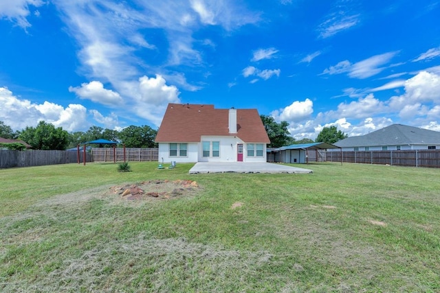 131 Martin Crossing Dr, Cedar Creek, TX 78612 - rear view of house featuring a patio, a fenced backyard, and a storage shed