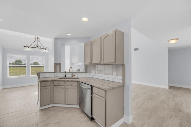 131 Martin Crossing Dr, Cedar Creek, TX 78612 - kitchen featuring stainless steel dishwasher, light wood-style flooring, light stone counters, recessed lighting, and a chandelier