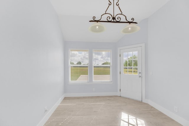 131 Martin Crossing Dr, Cedar Creek, TX 78612 - unfurnished dining area with vaulted ceiling and light wood-style floors