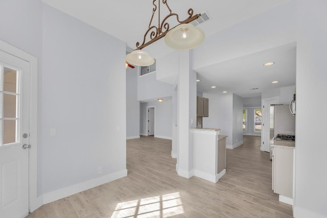 131 Martin Crossing Dr, Cedar Creek, TX 78612 - kitchen featuring light countertops, light wood-type flooring, recessed lighting, and stainless steel gas stovetop