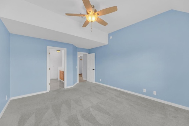 131 Martin Crossing Dr, Cedar Creek, TX 78612 - unfurnished bedroom featuring carpet, vaulted ceiling, and connected bathroom
