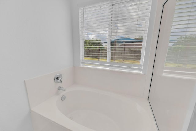 131 Martin Crossing Dr, Cedar Creek, TX 78612 - bathroom featuring a garden tub