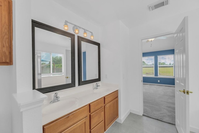 131 Martin Crossing Dr, Cedar Creek, TX 78612 - bathroom with double vanity and tile patterned floors