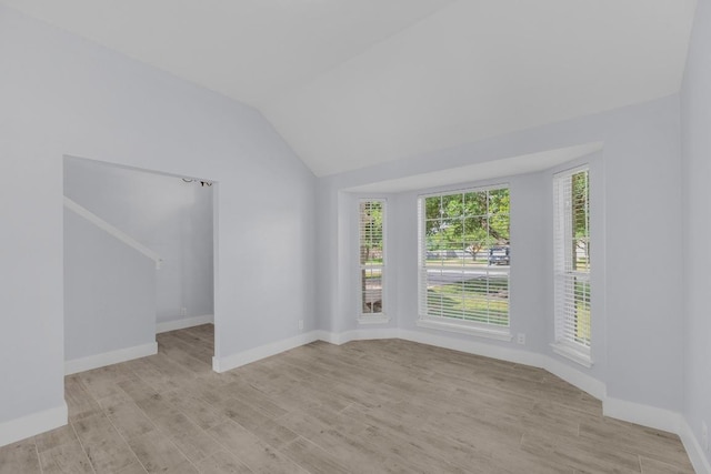 131 Martin Crossing Dr, Cedar Creek, TX 78612 - unfurnished room with light wood-style flooring and vaulted ceiling