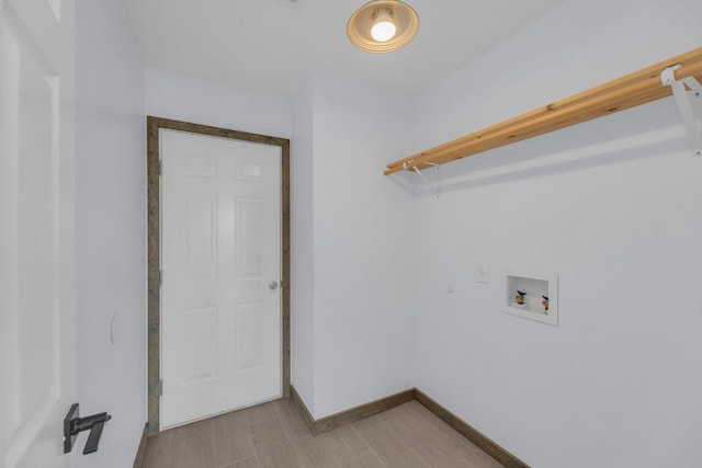 131 Martin Crossing Dr, Cedar Creek, TX 78612 - laundry area featuring hookup for a washing machine and light wood-style flooring