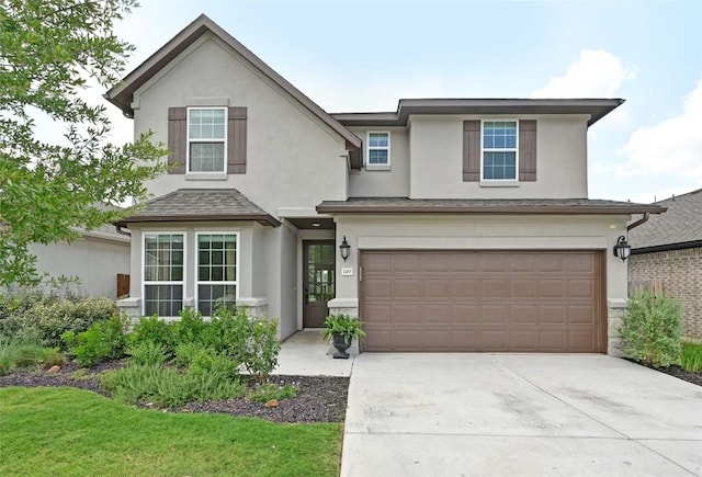 149 Beryl Way, Dripping Springs, TX 78620 - traditional-style house with stucco siding, an attached garage, and driveway