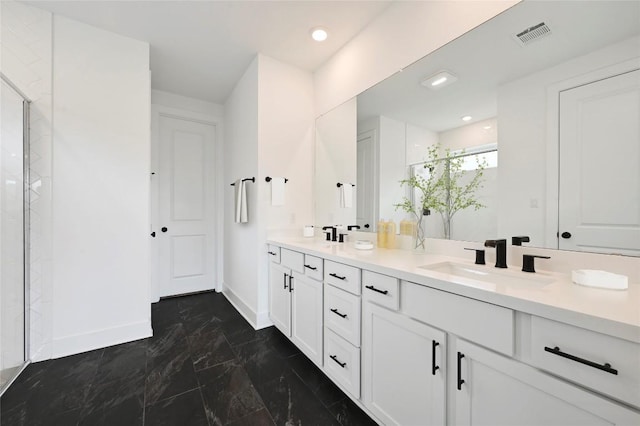149 Beryl Way, Dripping Springs, TX 78620 - bathroom featuring double vanity, marble finish flooring, and a stall shower