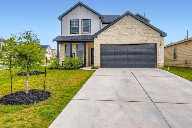 501 Goat Willow Ln, Georgetown, TX 78626 - view of front of home featuring stone siding, driveway, board and batten siding, and a front lawn
