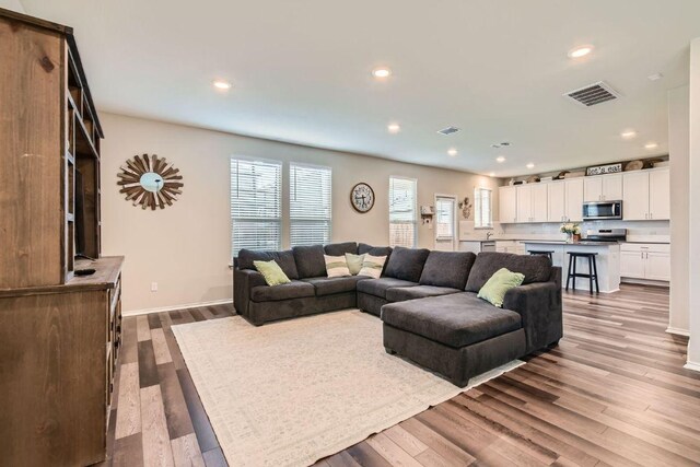 501 Goat Willow Ln, Georgetown, TX 78626 - living room with recessed lighting and wood finished floors