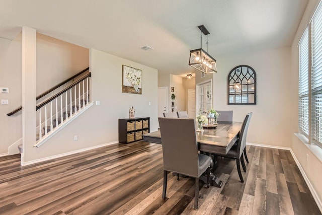 501 Goat Willow Ln, Georgetown, TX 78626 - dining room featuring stairway, wood finished floors, and a chandelier