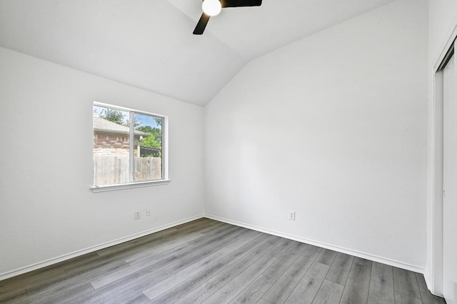 1105 Madrone Trl, Leander, TX 78641 - unfurnished bedroom with lofted ceiling, wood finished floors, a closet, and ceiling fan