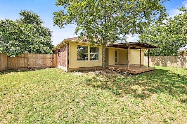 1105 Madrone Trl, Leander, TX 78641 - back of house with a fenced backyard and a deck