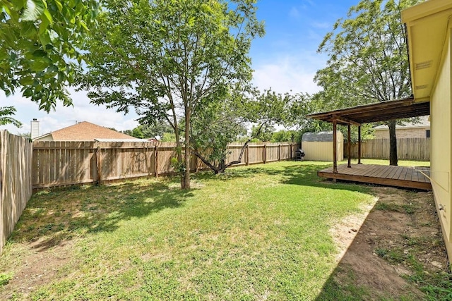 1105 Madrone Trl, Leander, TX 78641 - fenced backyard featuring a storage shed and a deck
