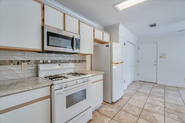 1705 Timberwood Dr, Cedar Park, TX 78613 - kitchen with white appliances, ornamental molding, tasteful backsplash, a textured ceiling, and light tile patterned flooring
