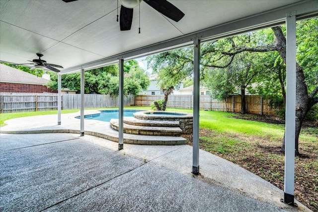 1705 Timberwood Dr, Cedar Park, TX 78613 - fenced backyard with a ceiling fan, a jacuzzi, and a patio