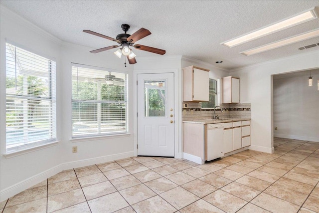 1705 Timberwood Dr, Cedar Park, TX 78613 - kitchen with white dishwasher, light countertops, light tile patterned floors, a textured ceiling, and crown molding