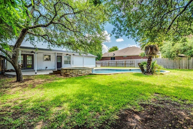 1705 Timberwood Dr, Cedar Park, TX 78613 - fenced backyard featuring ceiling fan, a patio area, and french doors