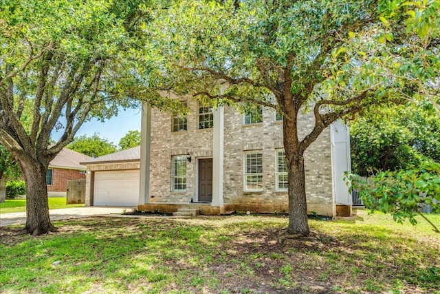 1705 Timberwood Dr, Cedar Park, TX 78613 - view of front of home featuring concrete driveway, a garage, brick siding, and a front yard