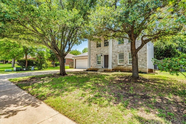 1705 Timberwood Dr, Cedar Park, TX 78613 - view of front of home with driveway, an attached garage, and a front lawn