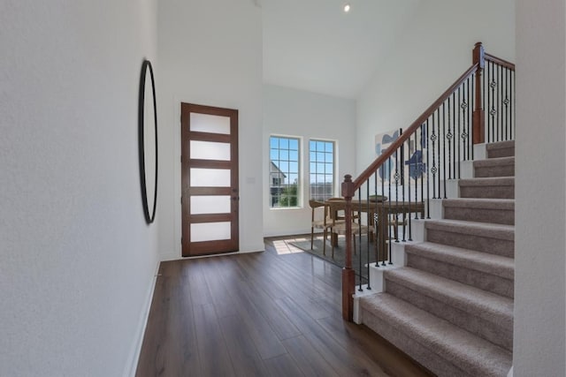 1916 Montella Way, Leander, TX 78641 - foyer entrance with a high ceiling, dark wood finished floors, and stairway