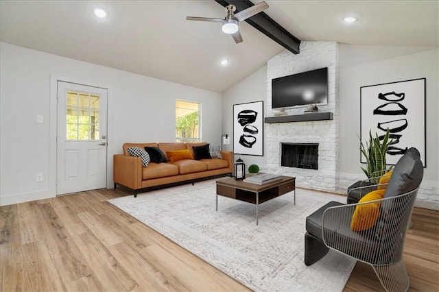 5500 Ferret Path, Austin, TX 78744 - living area featuring wood finished floors, healthy amount of natural light, a fireplace, and recessed lighting