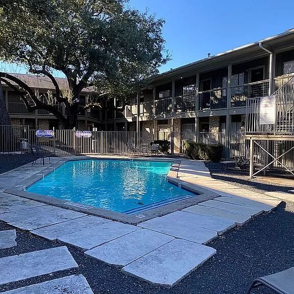 2303 Eastside Dr # 209, Austin, TX 78704 - community pool featuring a patio