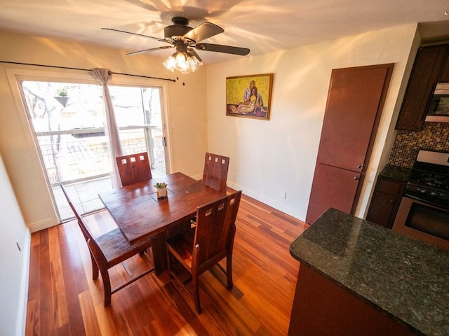 2303 Eastside Dr # 209, Austin, TX 78704 - dining area with dark wood-style flooring and a ceiling fan