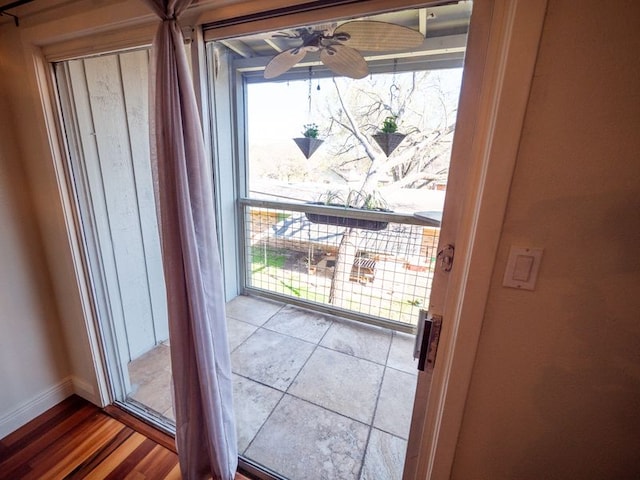 2303 Eastside Dr # 209, Austin, TX 78704 - doorway featuring baseboards and ceiling fan