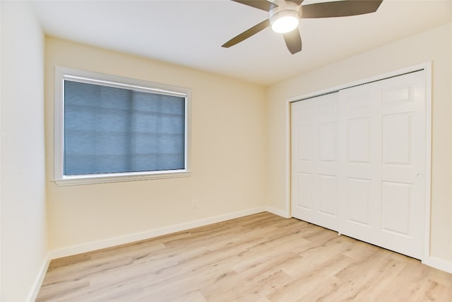5509 Kayview Dr, Austin, TX 78749 - unfurnished bedroom featuring wood finished floors, a closet, and a ceiling fan