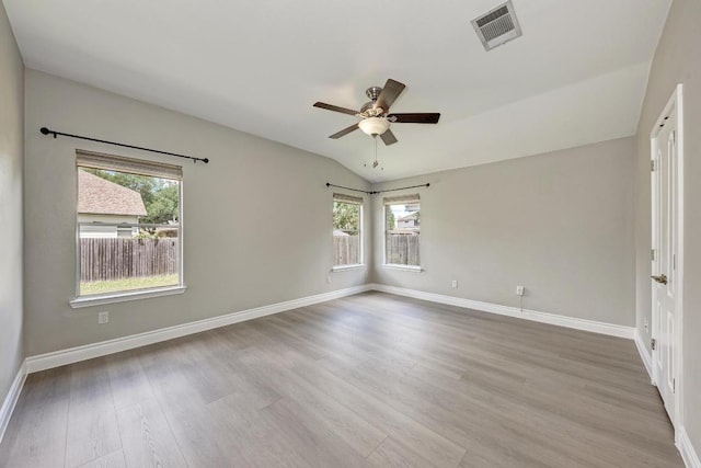 4408 Tello Path, Austin, TX 78749 - spare room featuring ceiling fan, wood finished floors, and vaulted ceiling