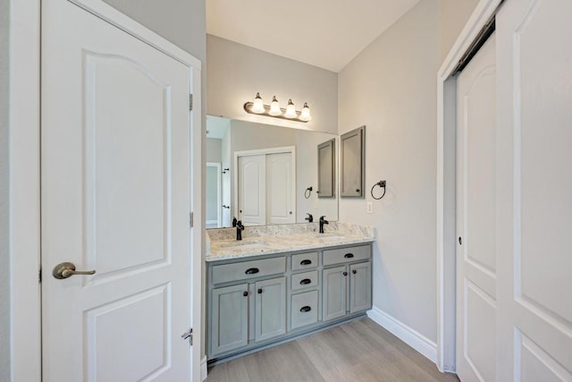 4408 Tello Path, Austin, TX 78749 - bathroom featuring double vanity and wood finished floors