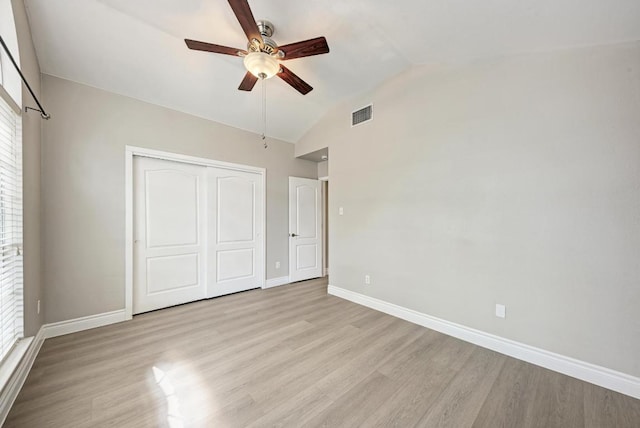 4408 Tello Path, Austin, TX 78749 - unfurnished bedroom featuring wood finished floors, lofted ceiling, a closet, and ceiling fan