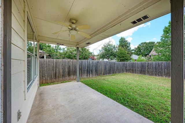 4408 Tello Path, Austin, TX 78749 - fenced backyard featuring a ceiling fan and a patio area