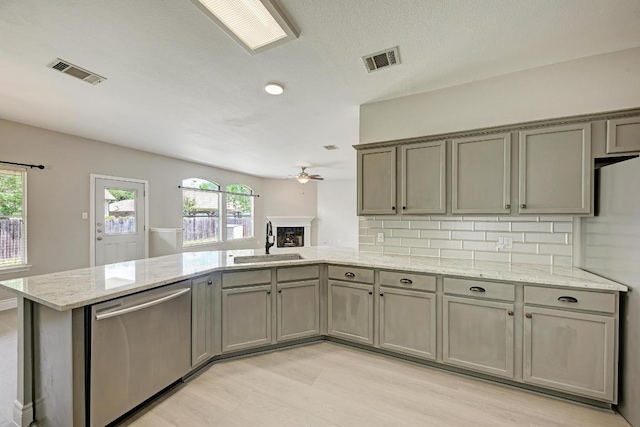 4408 Tello Path, Austin, TX 78749 - kitchen featuring dishwasher, gray cabinetry, ceiling fan, and healthy amount of natural light