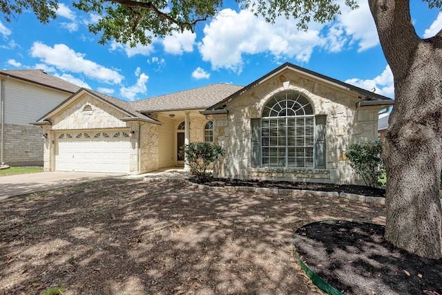 4408 Tello Path, Austin, TX 78749 - ranch-style home featuring stone siding, a garage, and concrete driveway